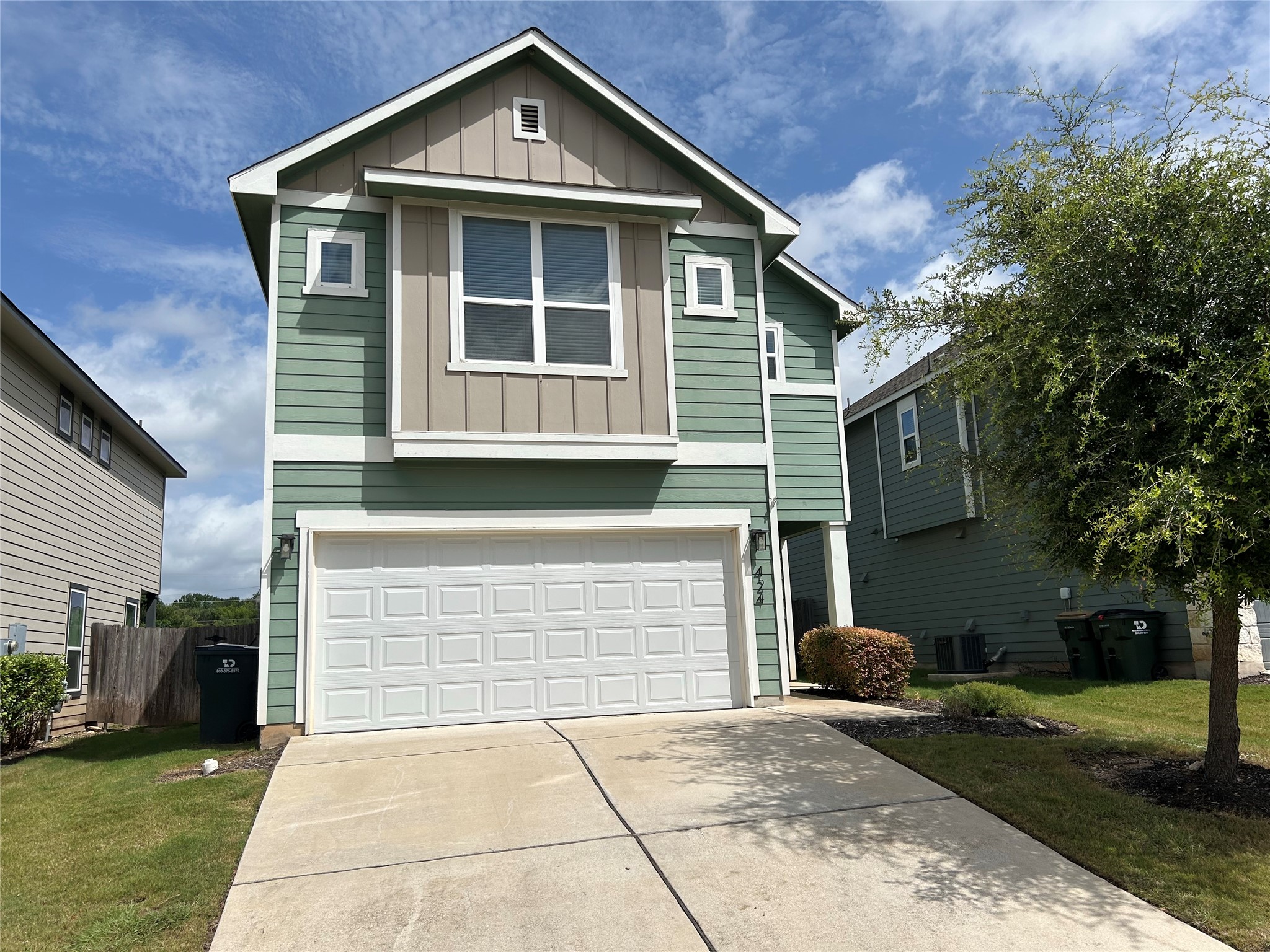 424 San Gabriel River Road Georgetown, TX 78626 - Photo 1 of 8 A welcoming facade presents with attractive siding and a clean concrete driveway leading to the garage.