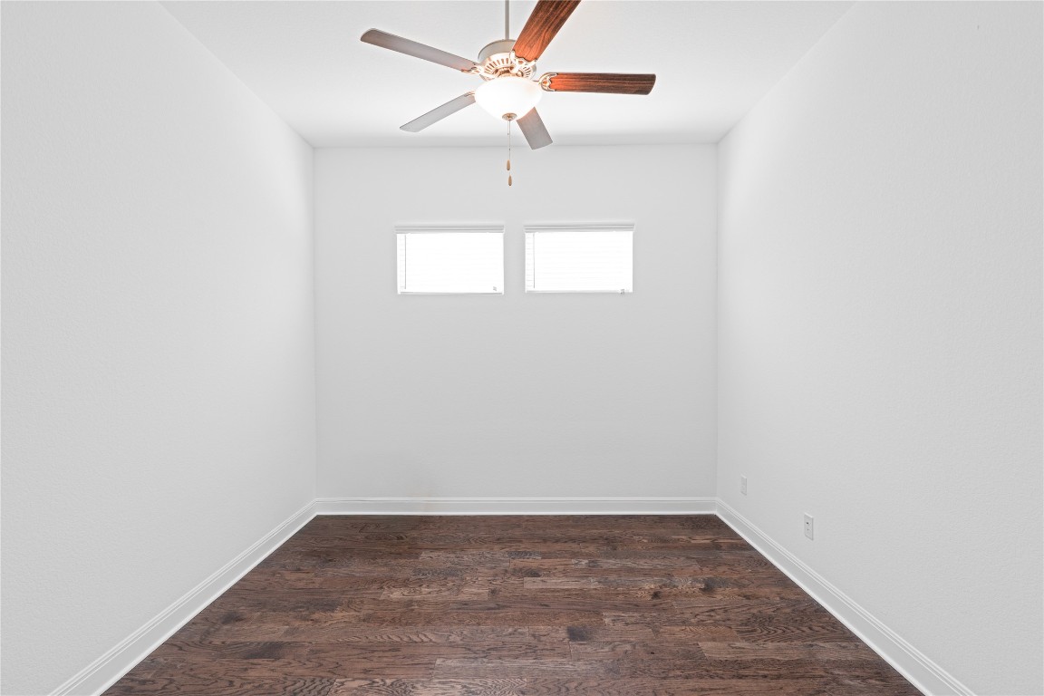 3037 Sage Ranch Drive Leander, TX 78641 - Photo 12 of 26 a view of a room with wooden floor and fan