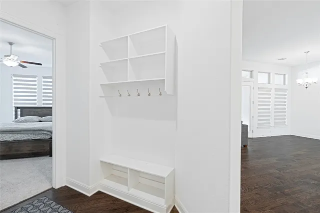 a bedroom with a bed and a desk