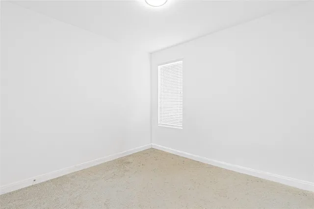 a bathroom with a bathtub sink vanity and mirror