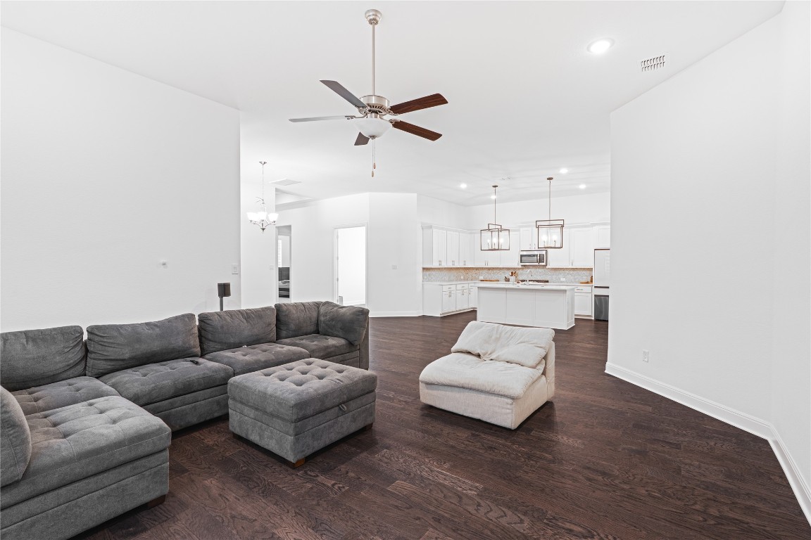 3037 Sage Ranch Drive Leander, TX 78641 - Photo 8 of 26 a living room with furniture and kitchen view