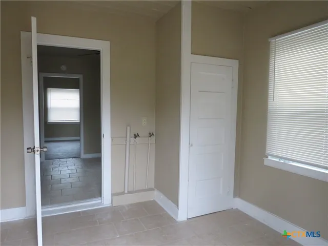 an empty room and closet area