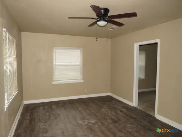 a view of an empty room with a window