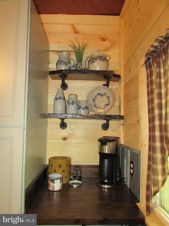 a kitchen with granite countertop a sink a stove and cabinets