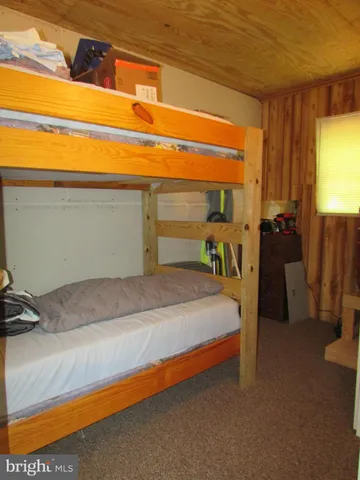 a room with a chair and a flat screen tv