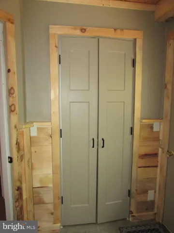 a bathroom with a sink a toilet a mirror and shower curtain