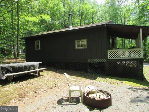 a side view of a house with a yard