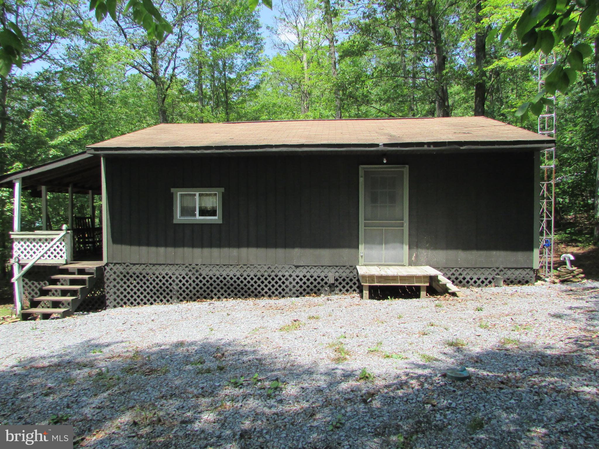 293 Snow Shoe Mountain Forest Road Snow Shoe, PA 16874 - Photo 25 of 38 a side view of a house with a yard