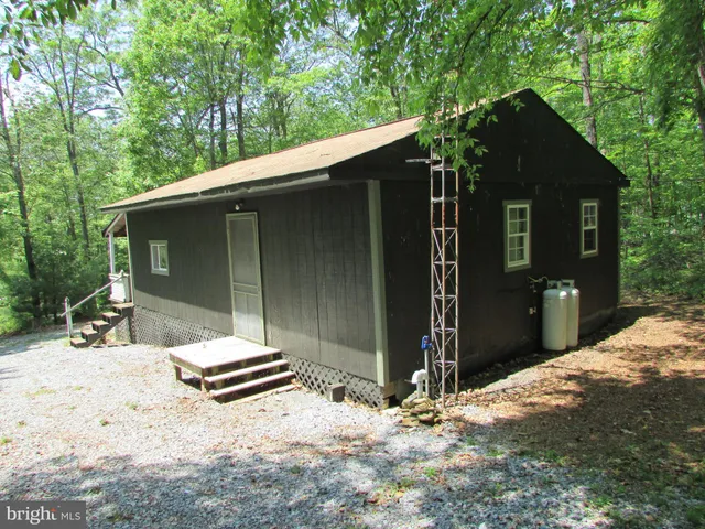 a house with trees in the background