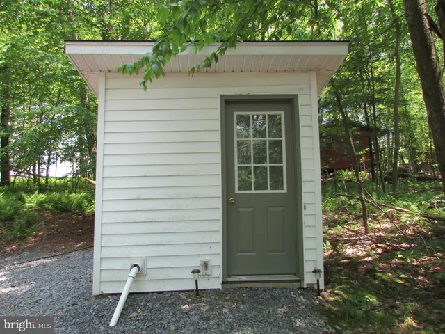 a view of a house with a tree