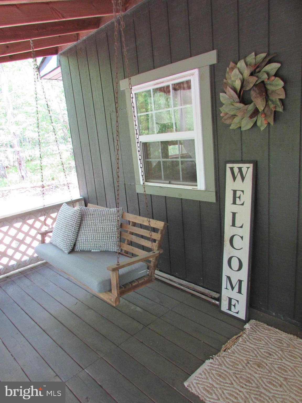 293 Snow Shoe Mountain Forest Road Snow Shoe, PA 16874 - Photo 4 of 38 a living room with furniture and a window