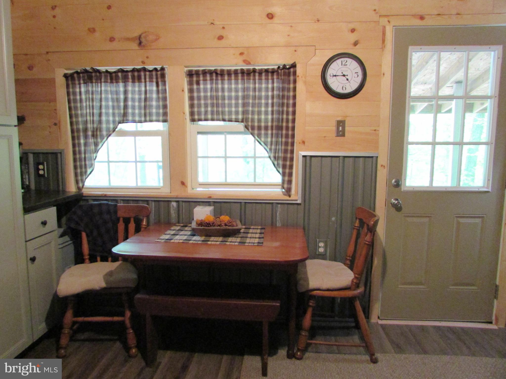 293 Snow Shoe Mountain Forest Road Snow Shoe, PA 16874 - Photo 9 of 38 a dining room with furniture and window