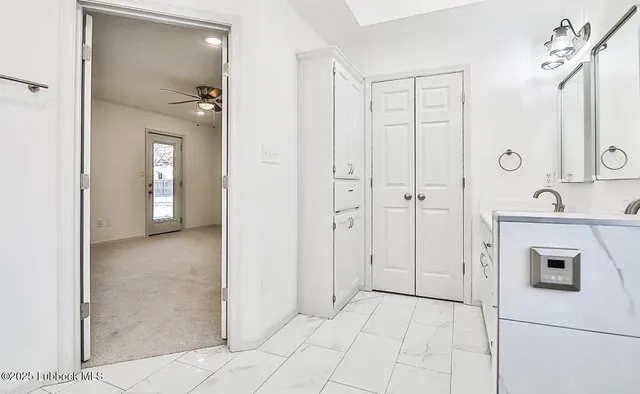 a view of a bathroom with a shower and a sink