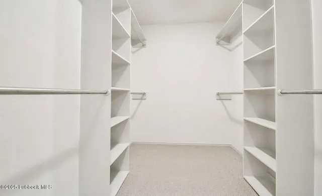 a view of an empty walk in closet