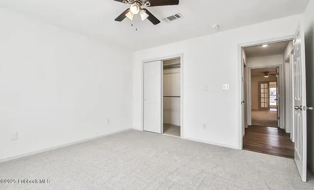 an empty room with fan