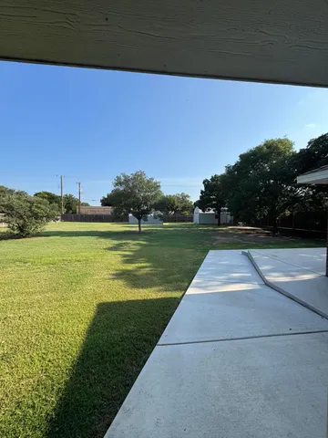 a view of a lake with a yard