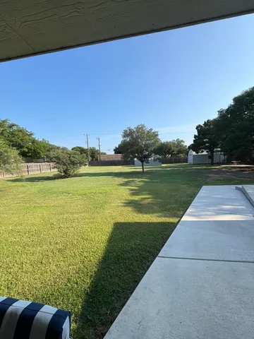 a view of a lake with a big yard