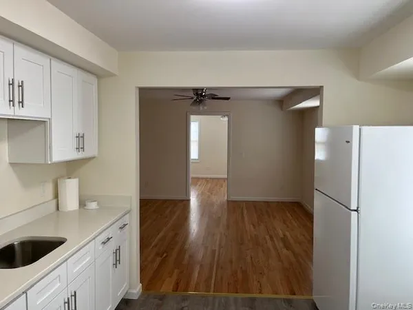 a kitchen with a refrigerator and cabinets