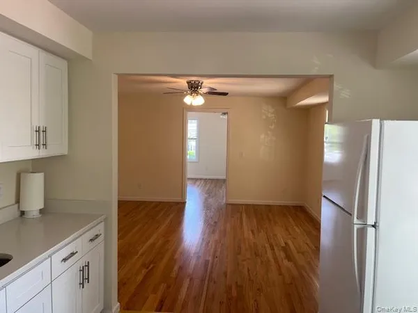 a view of hallway with wooden floor