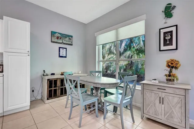 a dining room with furniture and window