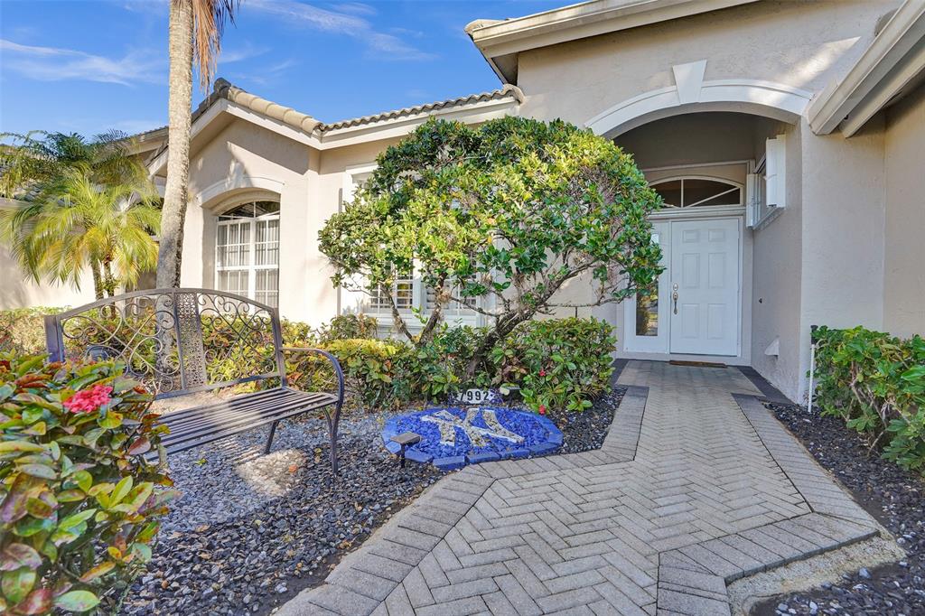 7992 Rockford Road Boynton Beach, FL 33472 - Photo 3 of 48 a front view of a house