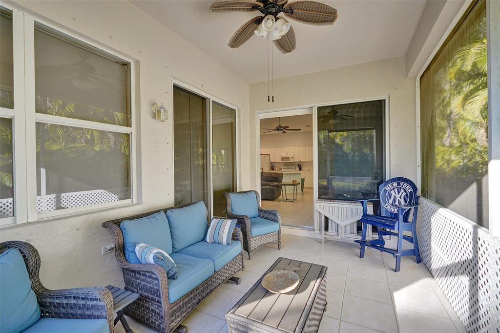 7992 Rockford Road Boynton Beach, FL 33472 - Photo 36 of 48 a living room with furniture and a large window