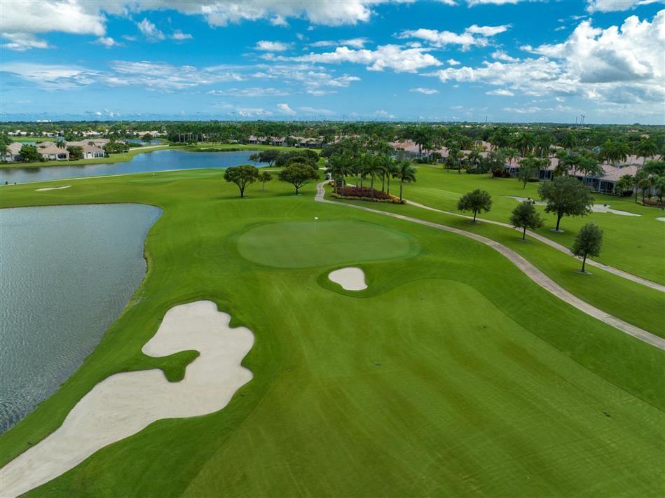 7992 Rockford Road Boynton Beach, FL 33472 - Photo 43 of 48 a view of a golf course with a lake