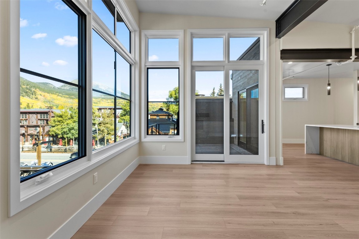 310 East Main Street, Unit 202 Frisco, CO 80443 - Photo 11 of 45 a view of front door and porch with wooden floor