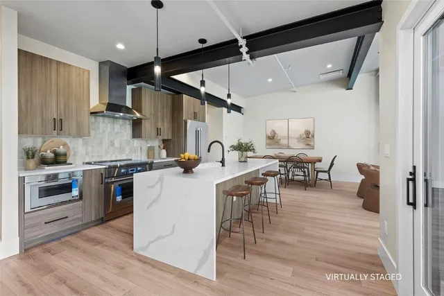 a kitchen with sink cabinets and wooden floor