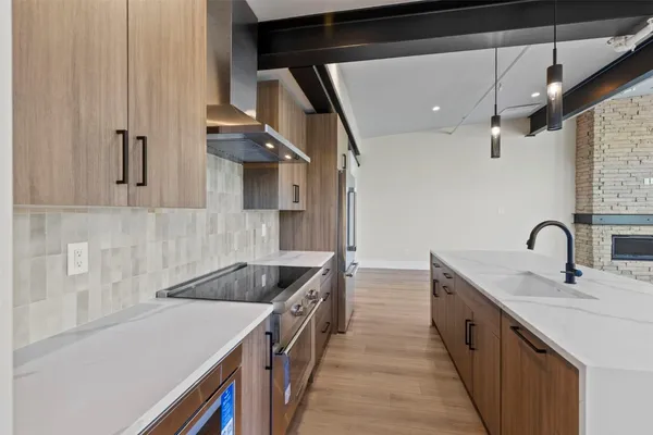 a kitchen with a sink and cabinets