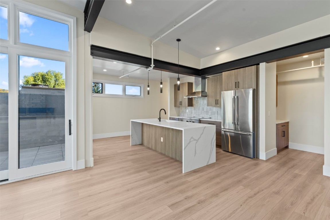 310 East Main Street, Unit 202 Frisco, CO 80443 - Photo 15 of 45 a kitchen with stainless steel appliances granite countertop a refrigerator a sink and a stove