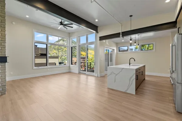 a large space with lots of wooden cabinets and glass door