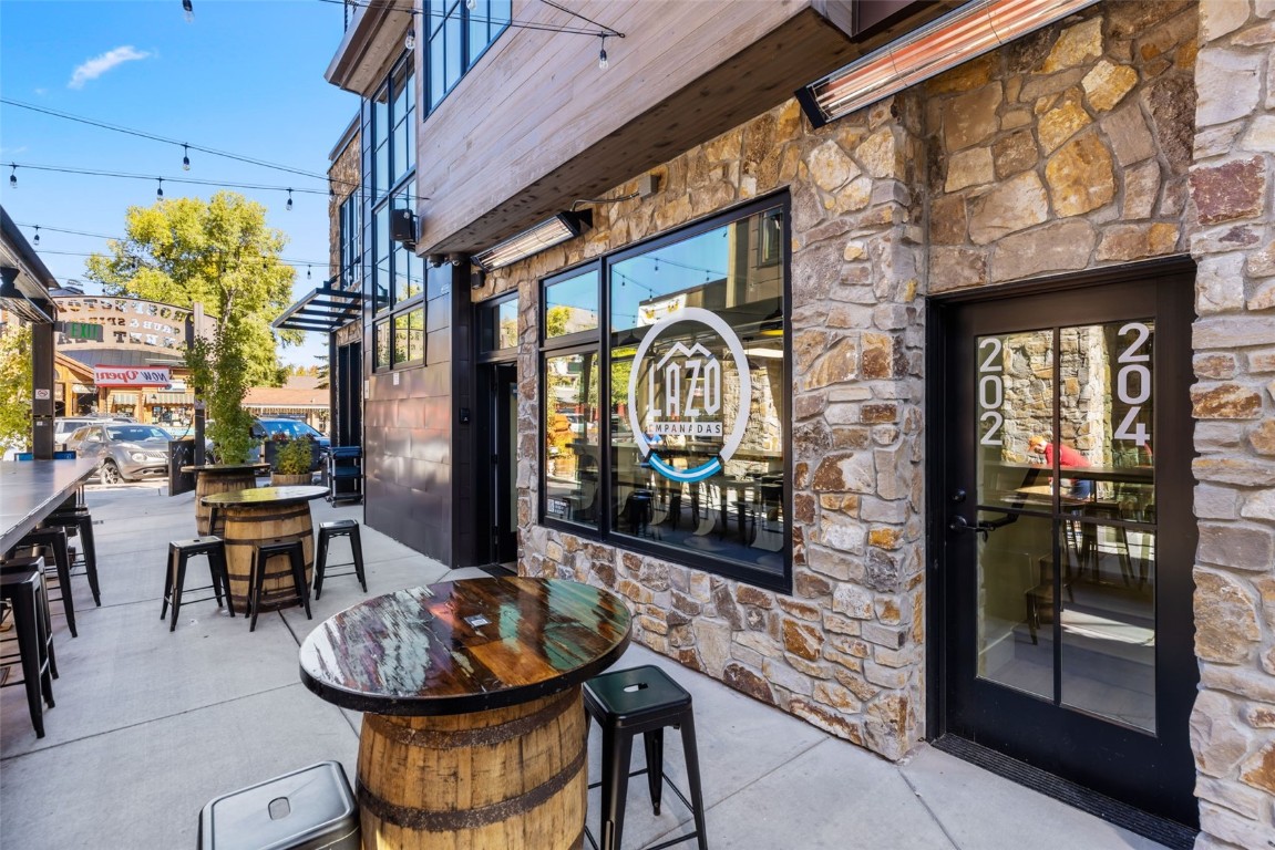 310 East Main Street, Unit 202 Frisco, CO 80443 - Photo 40 of 45 a view of a chairs and table in a patio