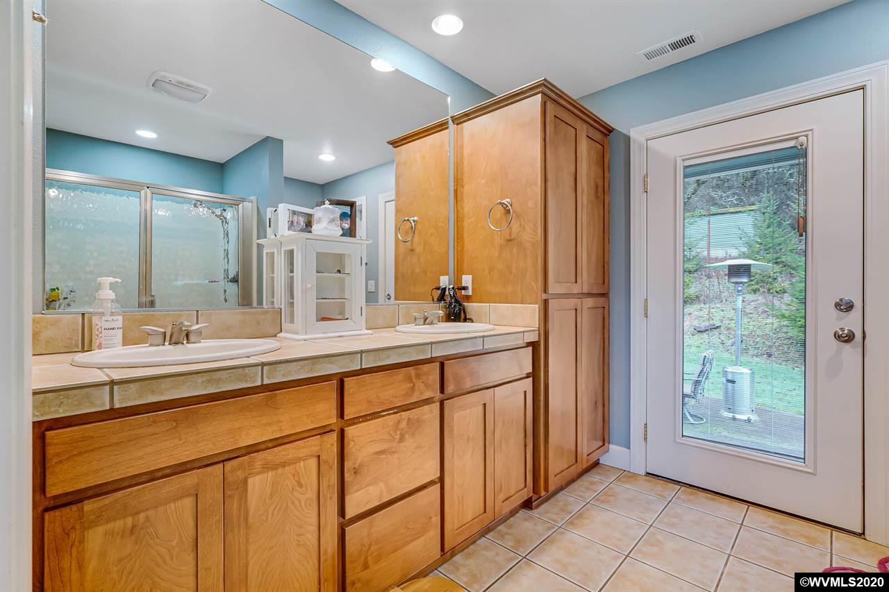 2065 Southeast Godsey Road Dallas, OR 97338 - Photo 26 of 34 a bathroom with a double vanity sink and a mirror