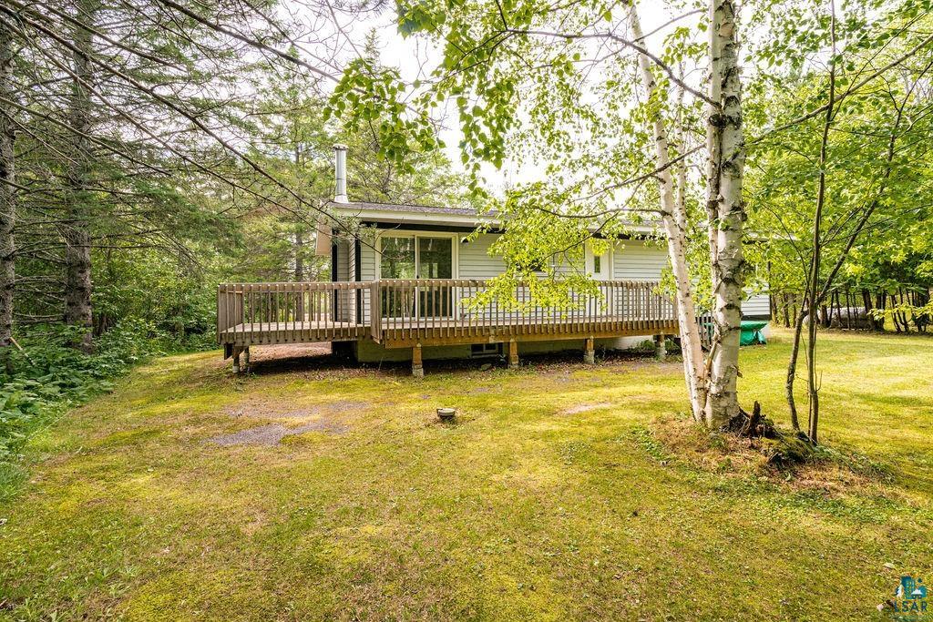 4002 Old Midway Road Hermantown, MN 55810 - Photo 15 of 19 Rear view of house featuring a deck and a lawn