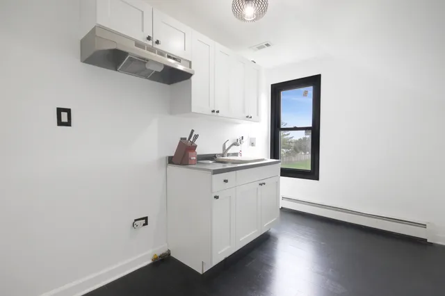 a view of backyard and deck