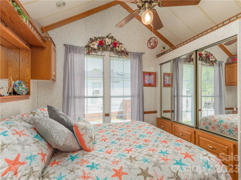258 Mallard Loop Waynesville, NC 28785 - Photo 13 of 22 a bedroom with a bed and a large window