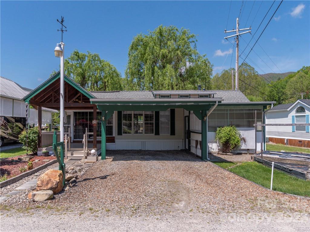 258 Mallard Loop Waynesville, NC 28785 - Photo 20 of 22 a front view of a house with garden