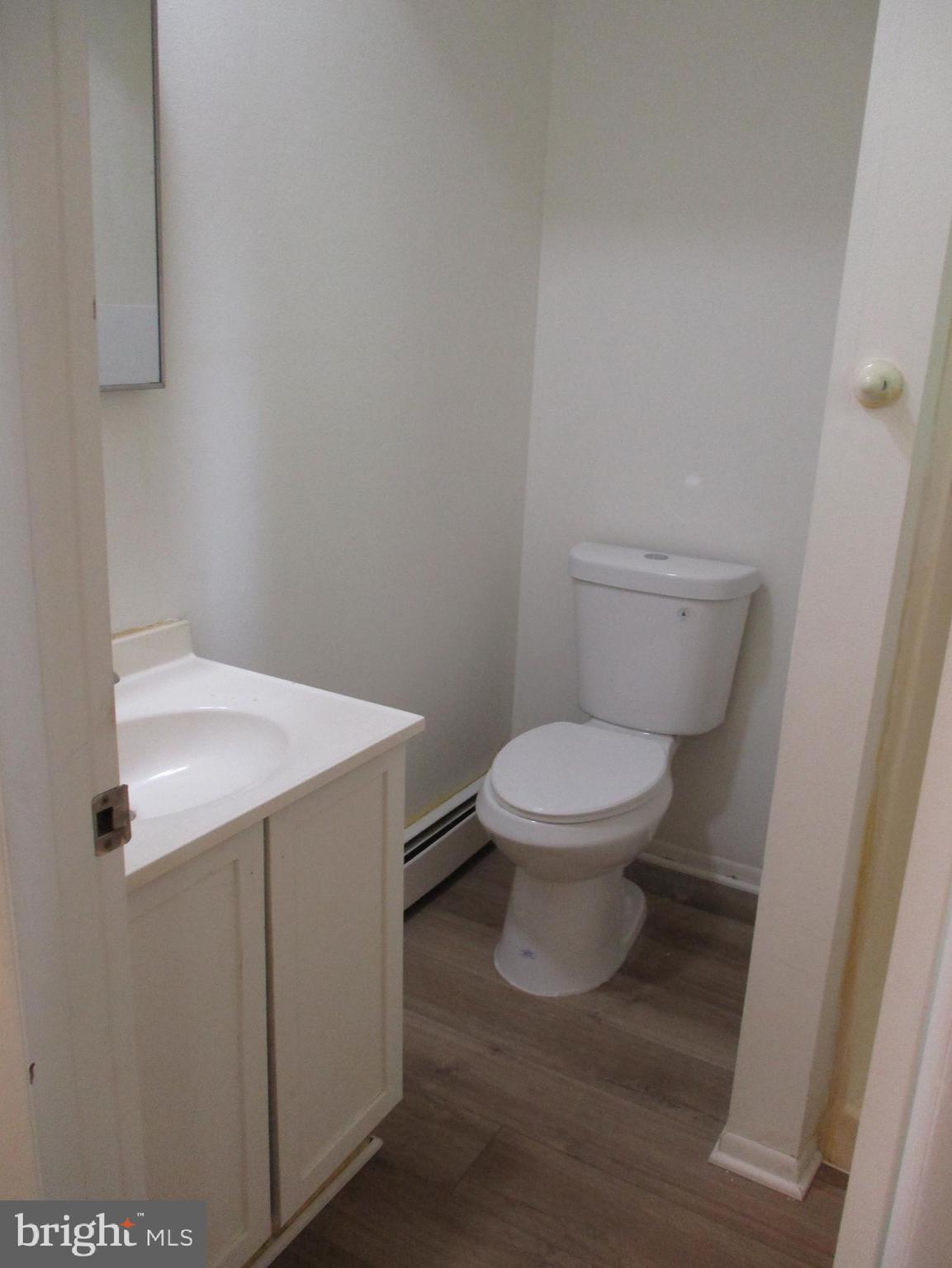 1 Fleming Drive, Unit B Hancock, MD 21750 - Photo 9 of 14 a white toilet sitting next to a white sink