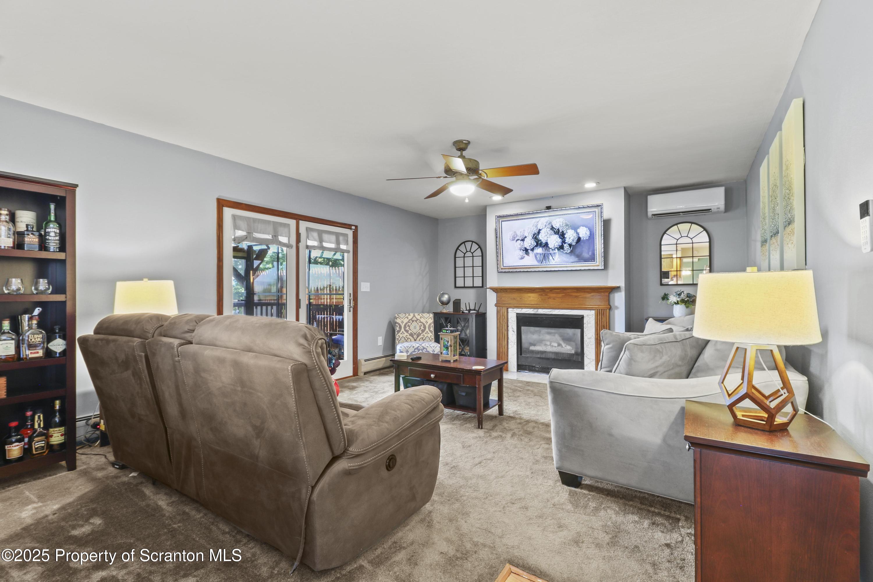 123 Ridgeview Drive Scranton, PA 18504 - Photo 12 of 53 a living room with furniture a fireplace and a window