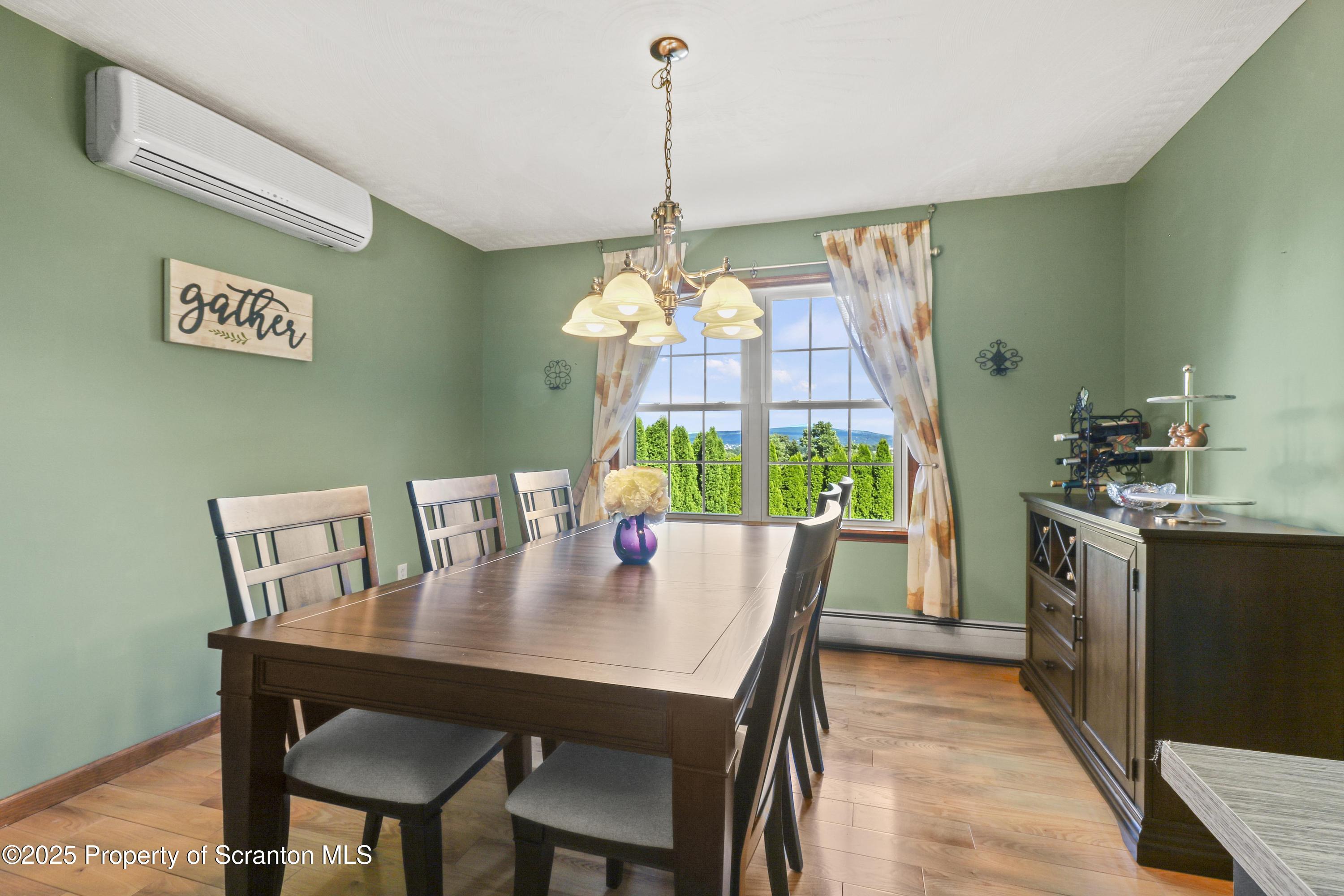 123 Ridgeview Drive Scranton, PA 18504 - Photo 15 of 53 a view of a dining room with furniture window and wooden floor
