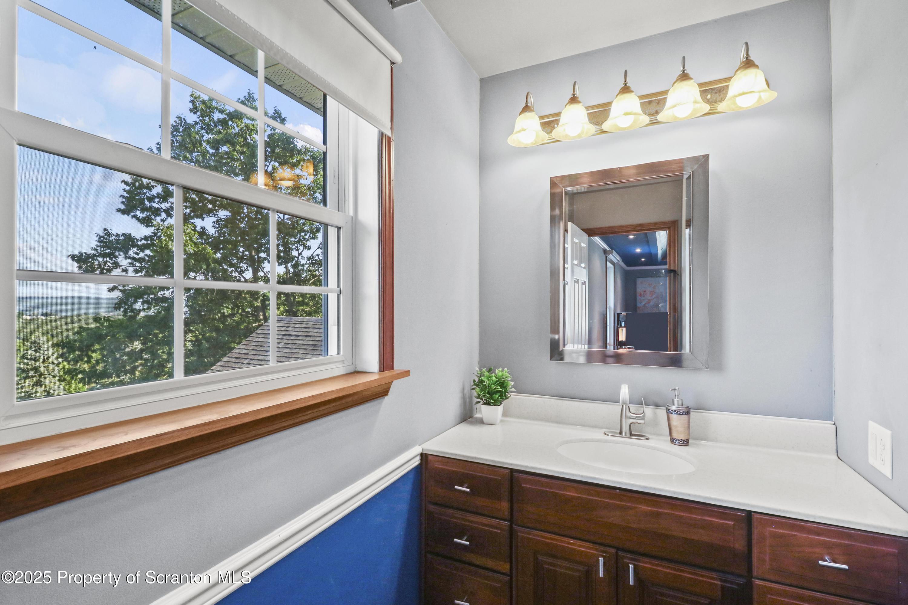 123 Ridgeview Drive Scranton, PA 18504 - Photo 37 of 53 a bathroom with a sink and a mirror