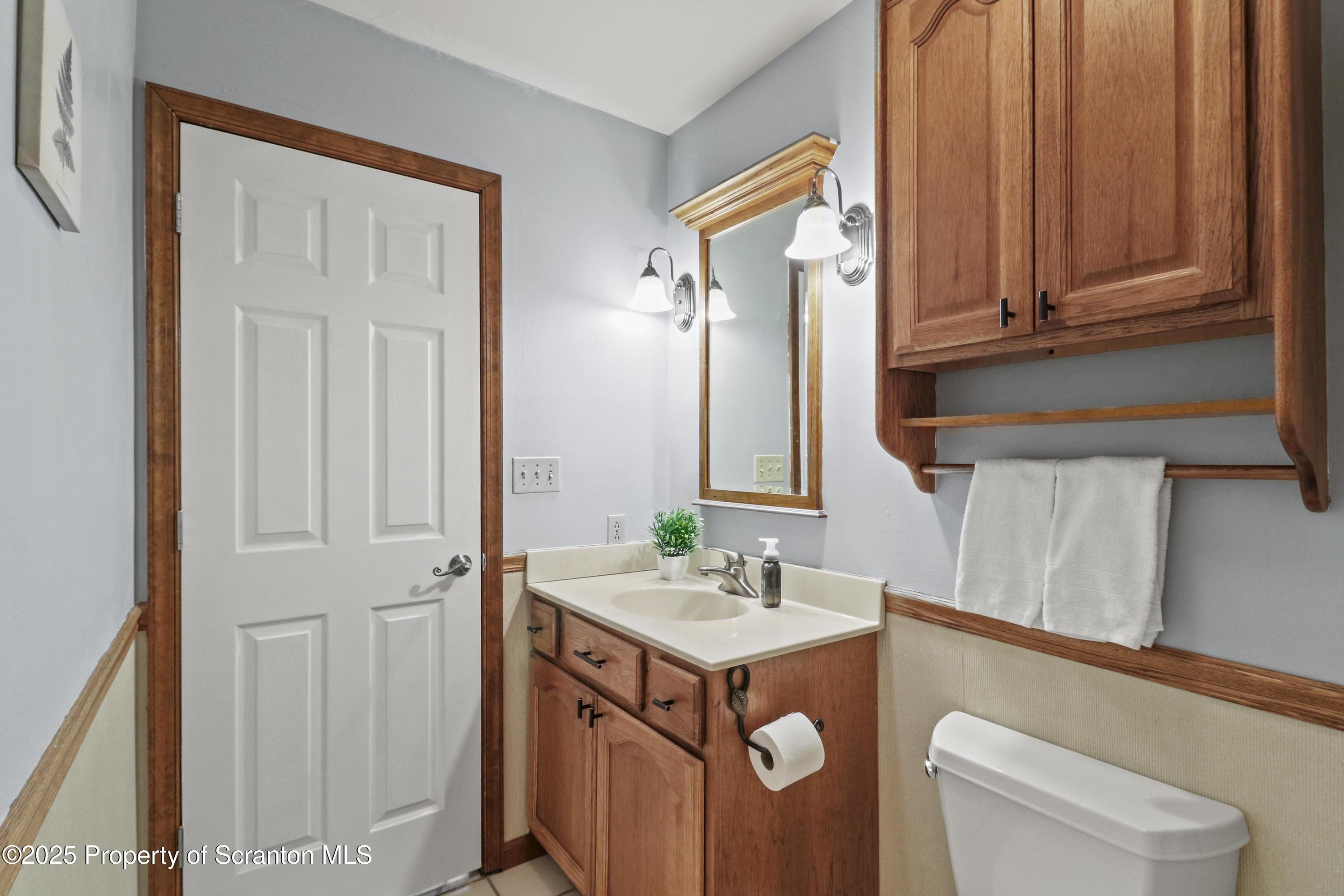 123 Ridgeview Drive Scranton, PA 18504 - Photo 44 of 53 a bathroom with a sink a toilet and mirror