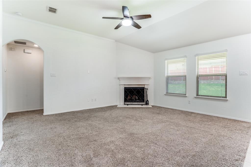 513 Wichita Trail McKinney, TX 75071 - Photo 11 of 12 an empty room with windows and fireplace