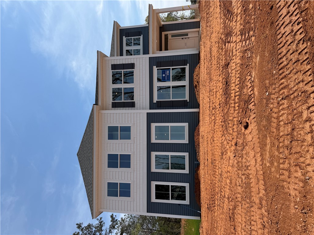405 Botany Lane Anderson, SC 29621 - Photo 2 of 14 This newly constructed residence showcases a contemporary facade with clean lines and inviting entry.