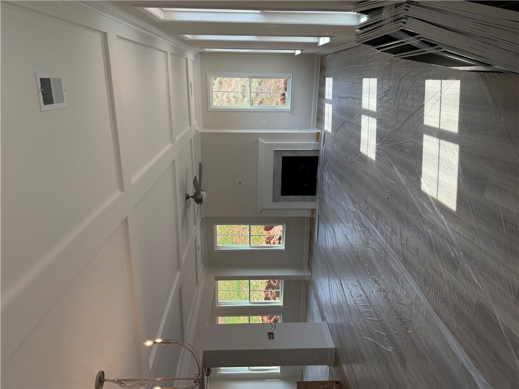 405 Botany Lane Anderson, SC 29621 - Photo 5 of 14 This bright living area features abundant natural light and an inviting fireplace, perfect for gatherings.