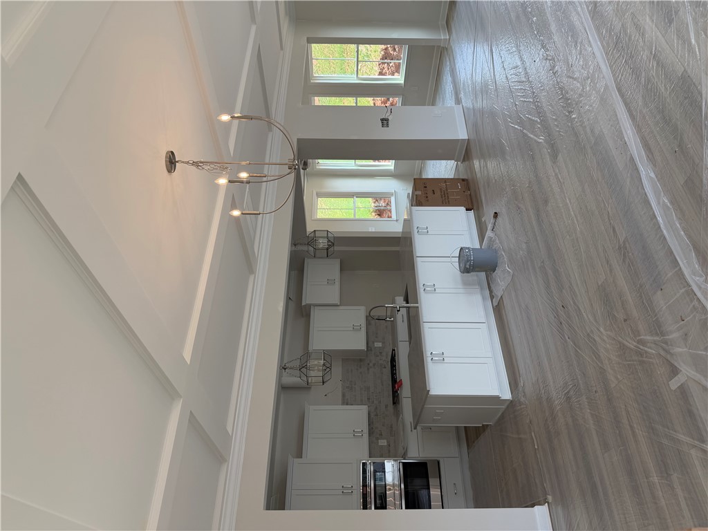 405 Botany Lane Anderson, SC 29621 - Photo 6 of 14 This spacious kitchen features high ceilings and ample cabinetry, ready for culinary adventures.