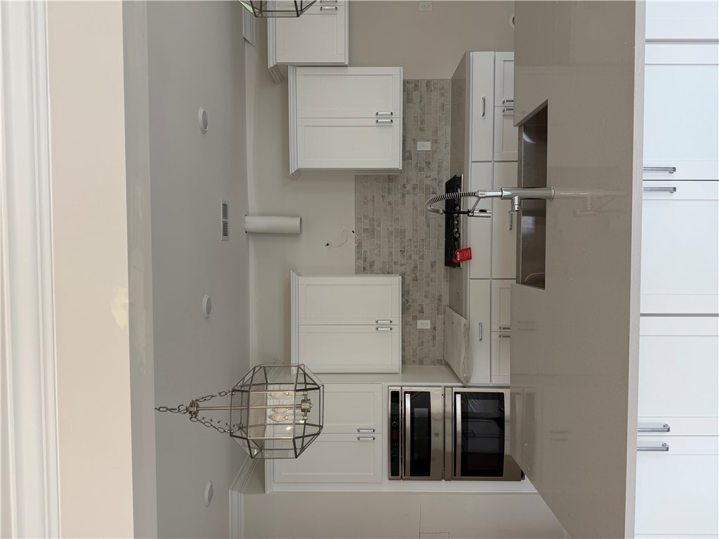 405 Botany Lane Anderson, SC 29621 - Photo 8 of 14 This modern culinary space features sleek white cabinetry and elegant finishes for effortless living.