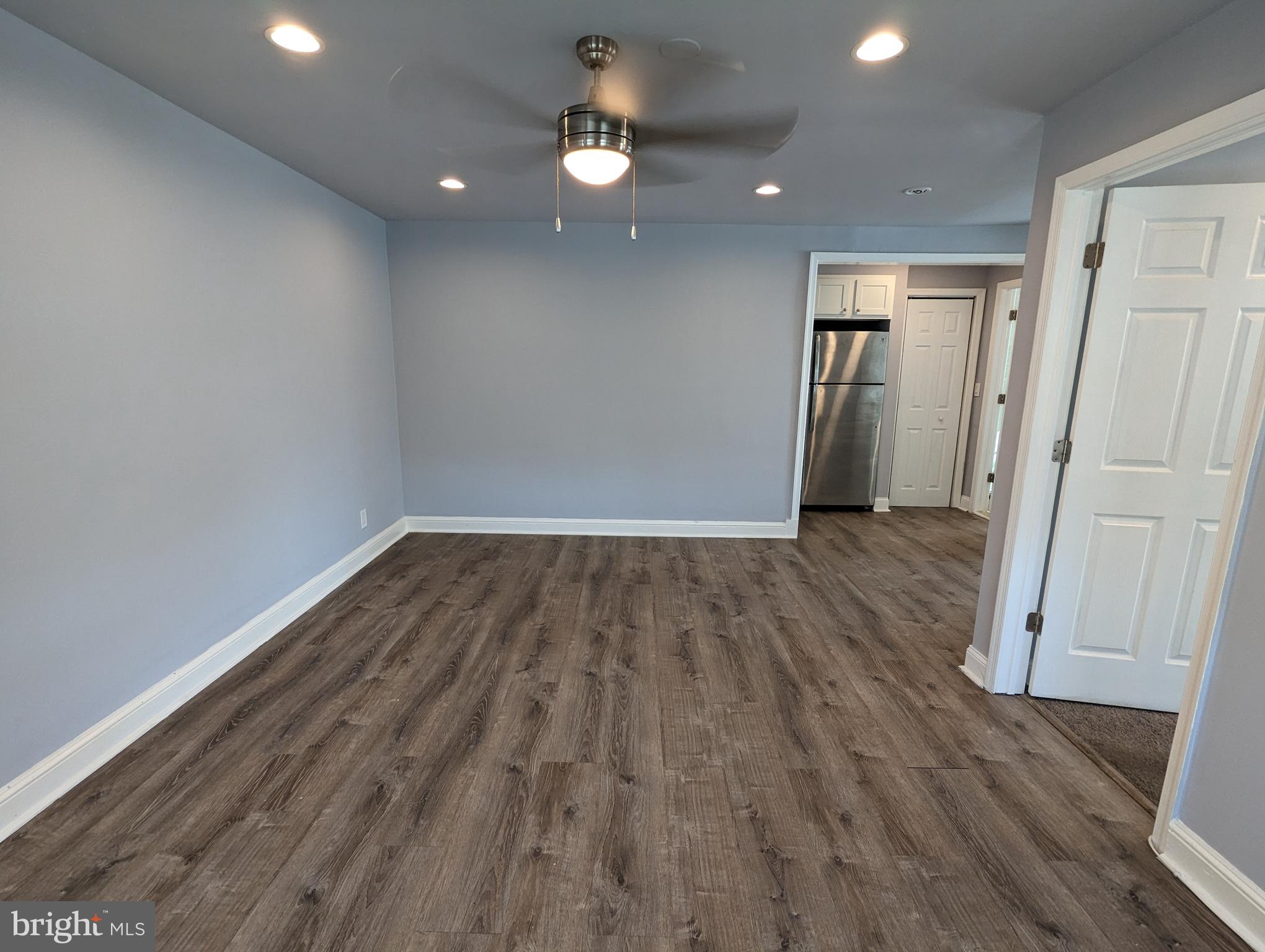 401 Montgomery Street, Unit 2 Laurel, MD 20707 - Photo 2 of 13 wooden floor in an empty room with a window