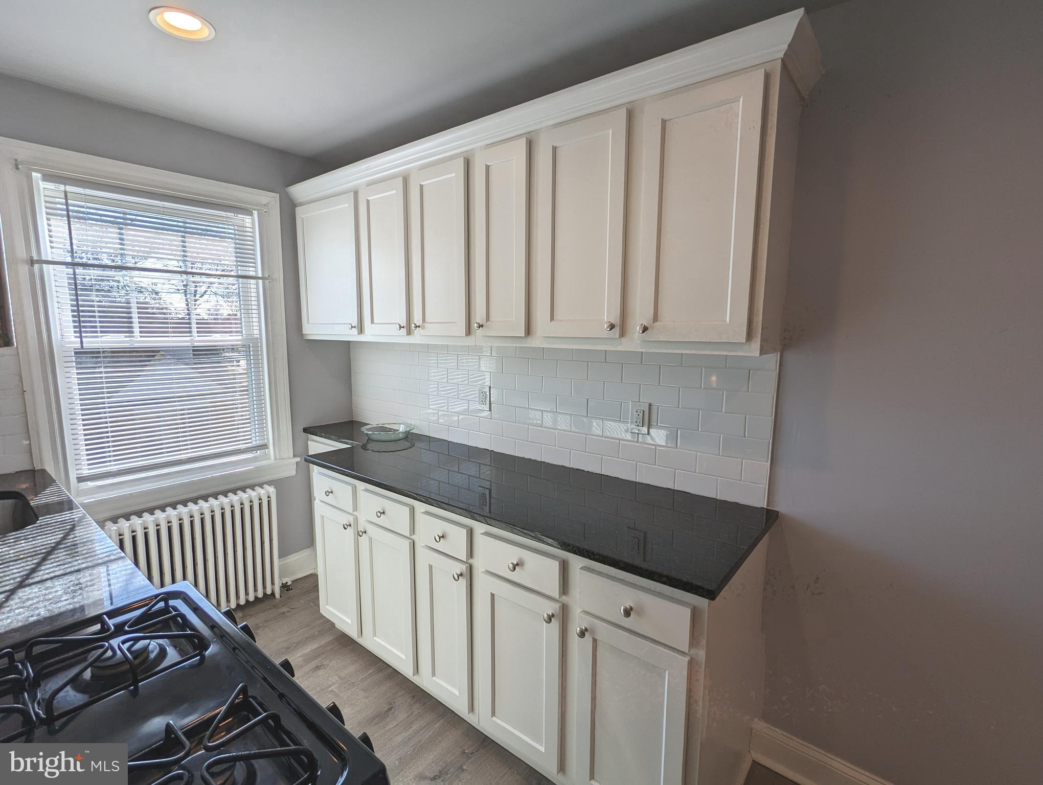 401 Montgomery Street, Unit 2 Laurel, MD 20707 - Photo 6 of 13 a kitchen with a sink and cabinets